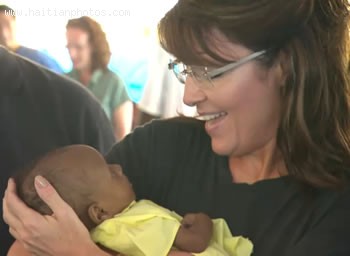 Sarah Palin With A Haitian Child