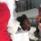 Santa Clause Bringing Gift To A Haitian Child On Christmas
