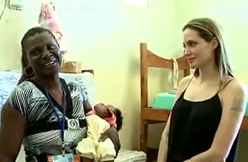 Angelina Jolie Talking To A Staff Member In Haiti