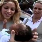 Shakira Admiring A Baby In Haiti