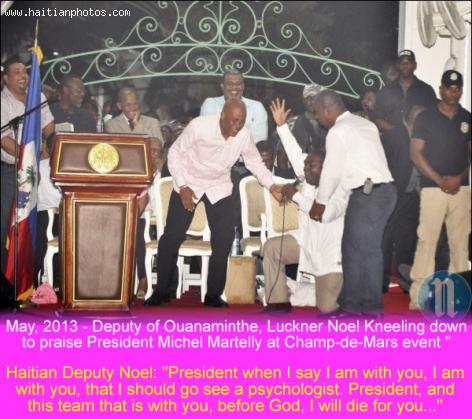Deputy Luckner Noel kneeling down before President Martelly