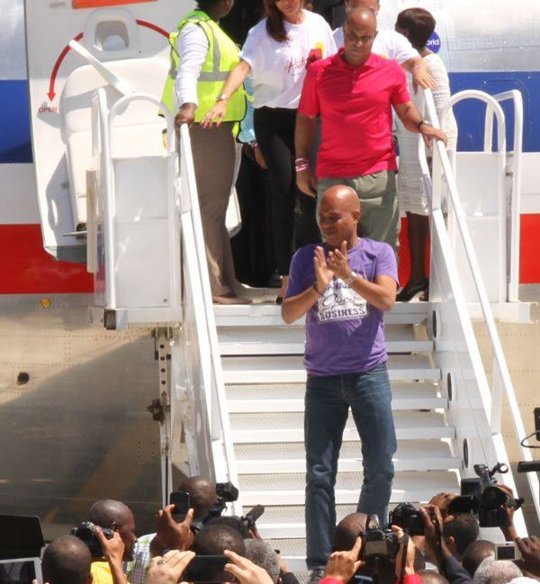 Michel Martelly and Laurent Lamothe on First American Airlines flight to Cap-Haitian