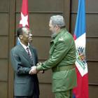 Former Haitian President Jean Bertrand Aristide with Fidel Castro of Cuba