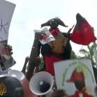 Francois Hollande in Haiti protesters demand reparations