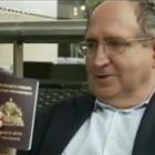 Ira Kurzban Showing The Haitian Passport For Jean-Bertrand Aristide